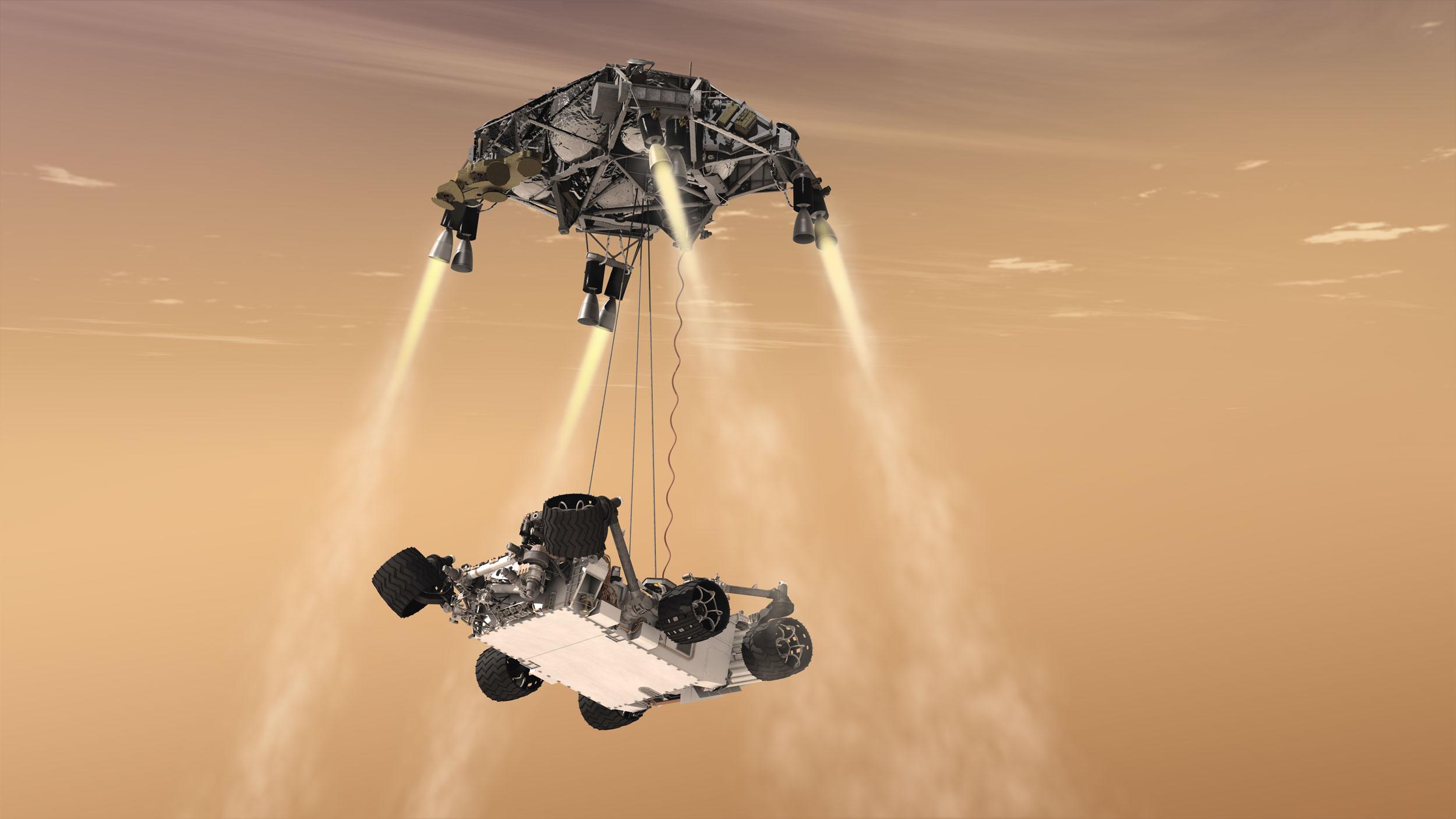 This artist's illustration shows the sky crane maneuver that delivered NASA's Curiosity rover to the surface of Mars in 2012, concluding what is known as the “seven minutes of terror”—the nail-biting descent through the thin Martian atmosphere. Credit: NASA